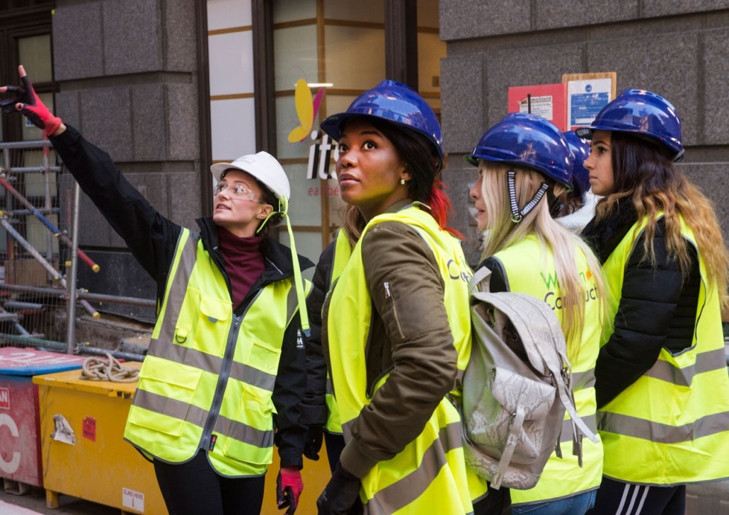 Four women workers on construction site